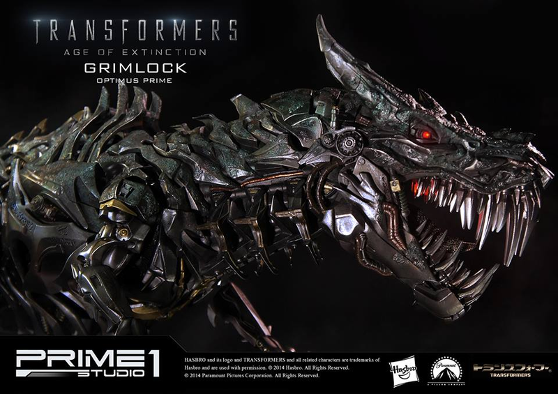 Illustration for article titled Glorious Grimlock and Optimus Prime Statue